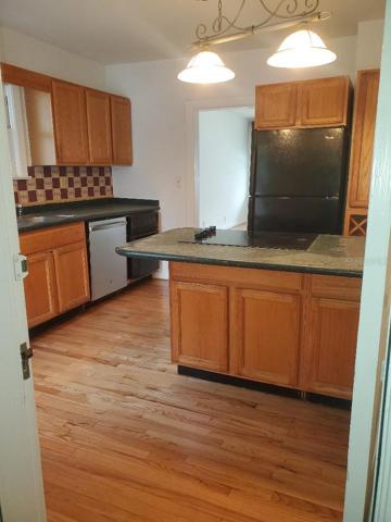 Refinished kitchen floor. New cooktop & dishwasher, 3 year warranty.