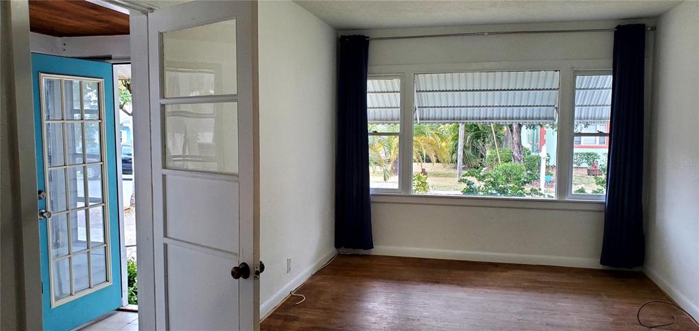 Living room with front entry porch on left.