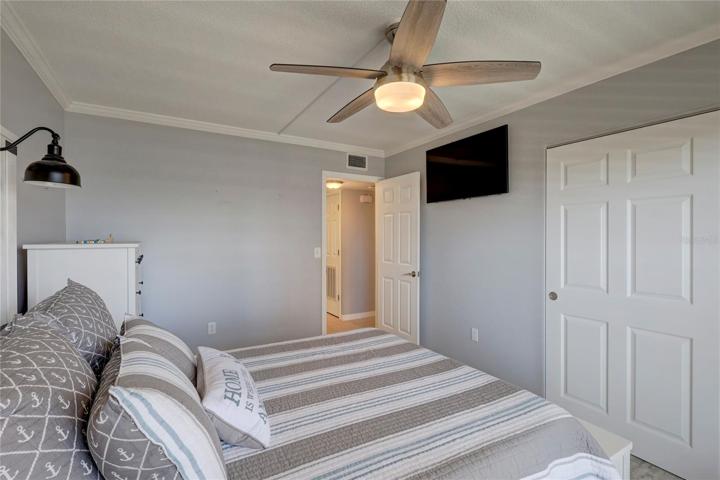 The guest bedroom has lots of lighting and is also very spacious.
