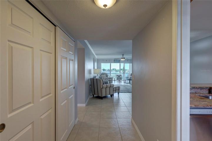 The hallway Leading into your beautiful home with a large storage closet.