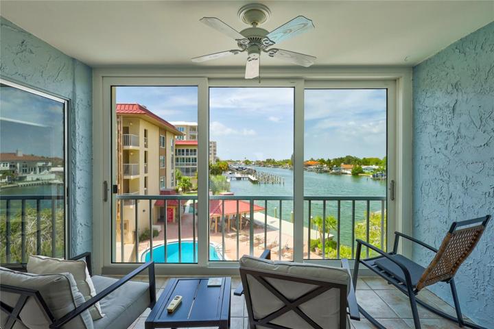 The enclosed Sun Room is right off the living room and has newer sliding doors for letting the outside in and to enjoy the view.