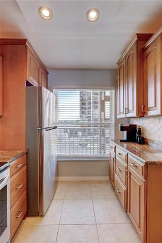 In the kitchen, there's also a window, to let in  natural light  and an extra set of cainets to make this kitchen the perfect place.