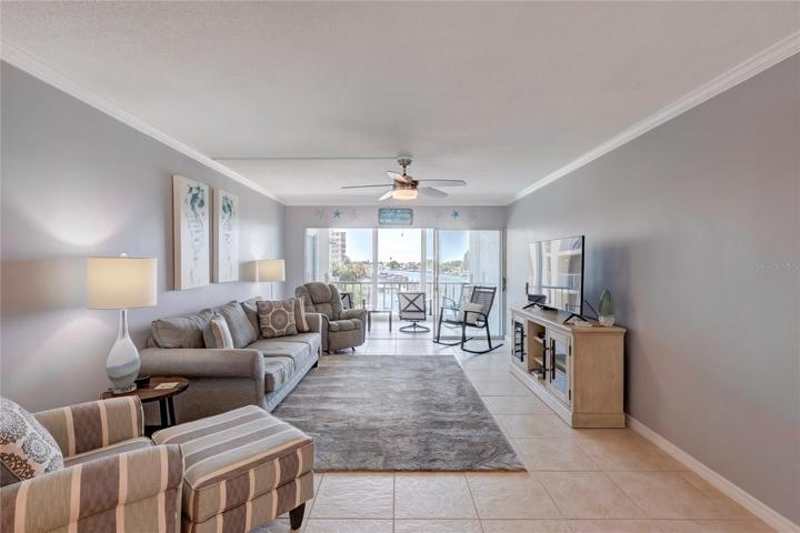 The living room is like a cozy haven, with comfortable sofas and soft cushions, perfect for lounging and unwinding.