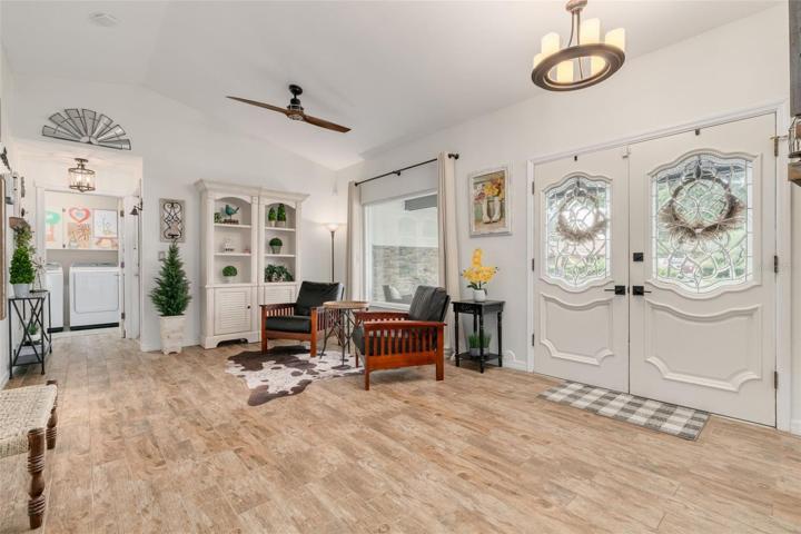 Upon entering the home you are greeted by a a spacious sitting room for reading, conversation while looking out a big, open window.