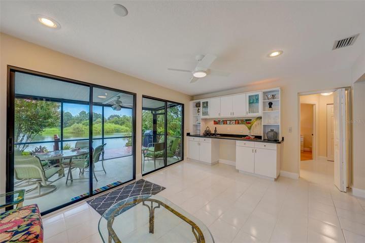 Stunning lake views from the sunroom. Looking toward hallway toward bedrooms 3 & 4.