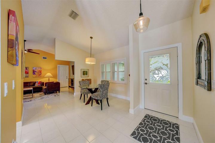 Dining area just off the kitchen with plantation shutters