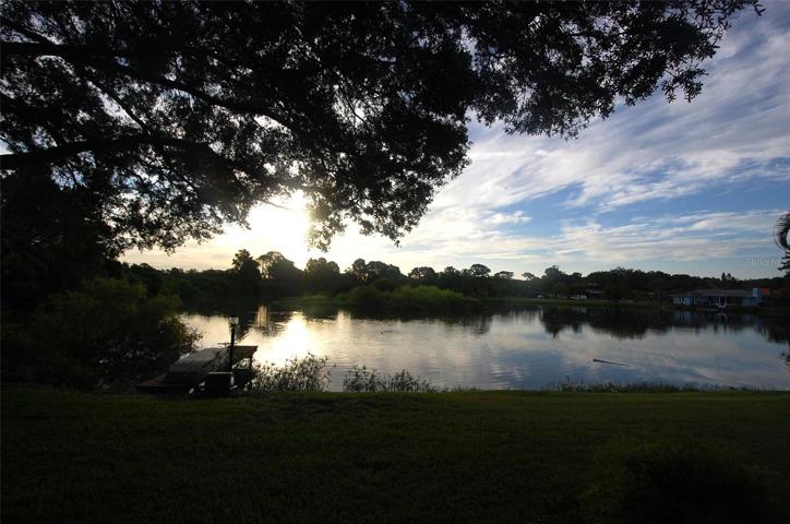 Sunrise glistening over the lake. Lake aeration system keeps water fresh around private dock.