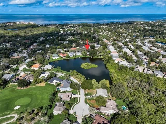 Aerial view showing proximity to the Gulf of Mexico. Tarpon Springs Golf Course across the lake.