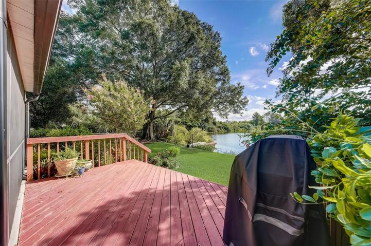 The well-manicured mature landscaping adds to the curb appeal and creates a serene tropical sanctuary in the back yard