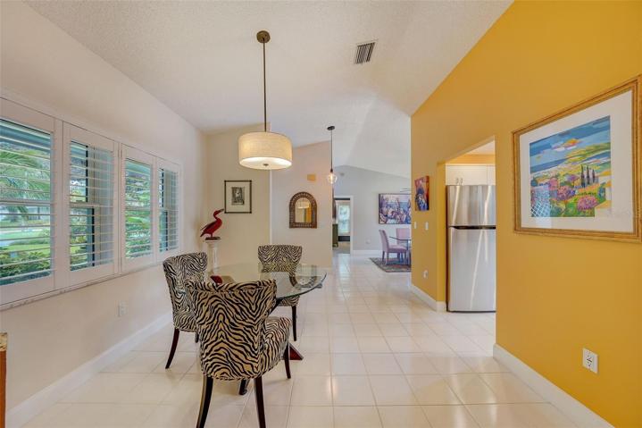 Dining area just off the kitchen with plantation shutters