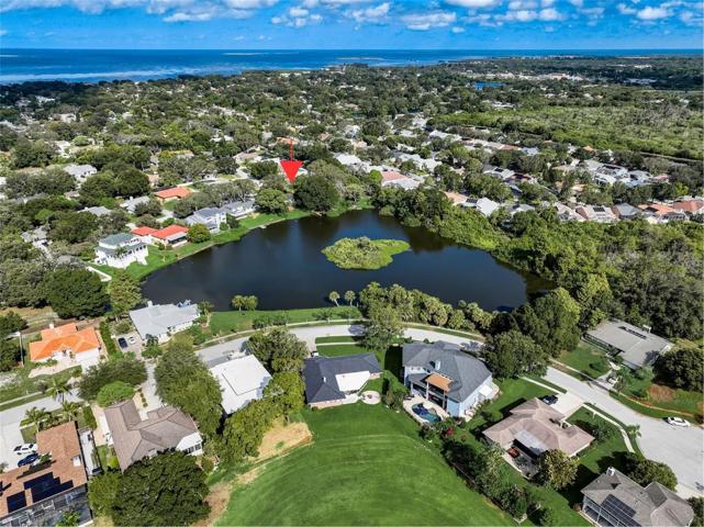 Aerial view showing proximity to the Gulf of Mexico. Tarpon Springs Golf Course across the lake.