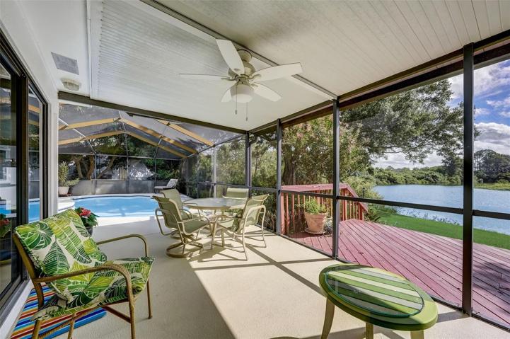 Enjoy entertaining your guests around the screened-in pool & covered patio area.