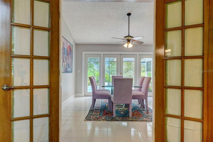 The second bedroom is complete with Frenchdoors, vaulted ceiling, large arched window overlooking the front yard, and would function well as a nursery or office