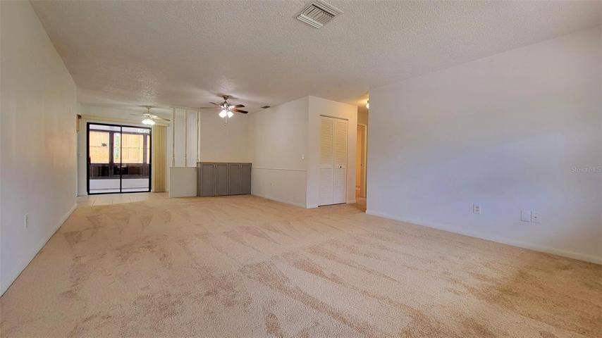 Living, dining & kitchen breakfast areas w/slider to lanai.