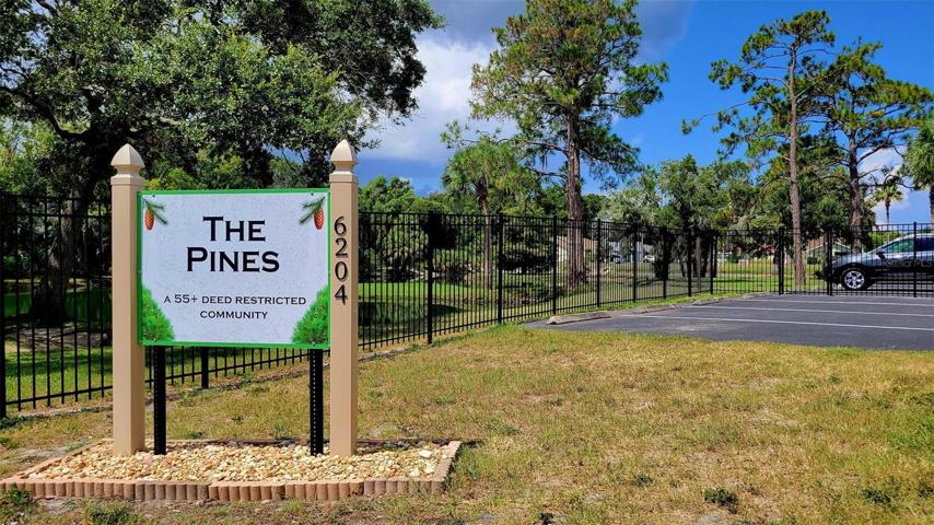 The Pines with guest parking by the entrance & at the clubhouse.