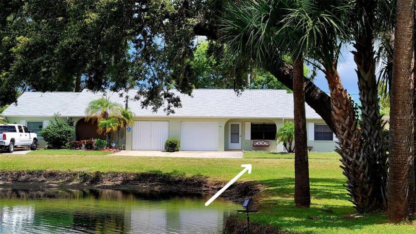 Relax on your front porch & watch the tropical birds in the pond.