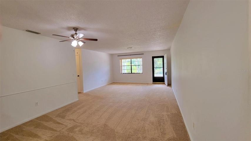 Living/Dining rooms. Screened storm door.