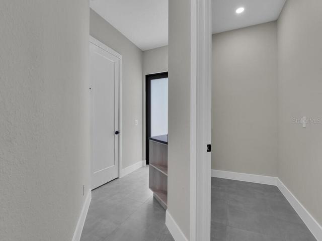 Laundry Room & Hallway To Pool Bath