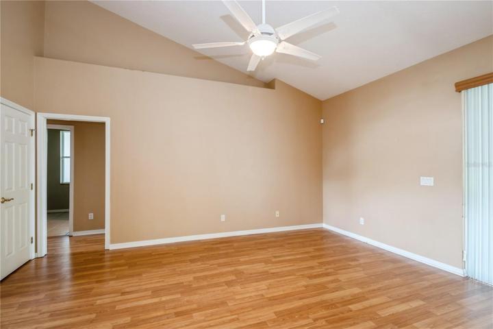 Spacious living room connects to dining room. Large sliding doors to outdoor patio