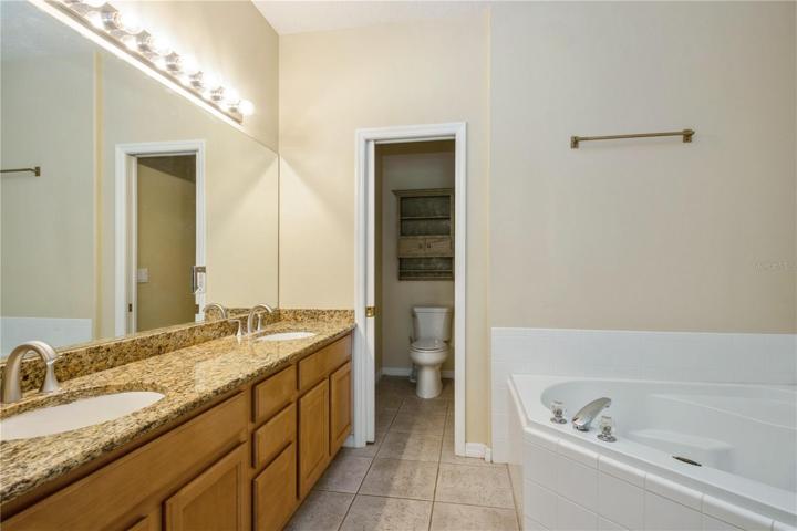 Primary bathroom, double sink with oval tub and shower too