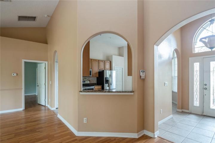 View looking back toward foyer and kitchen pass through