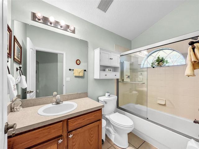 Architectural window over the tub with shower