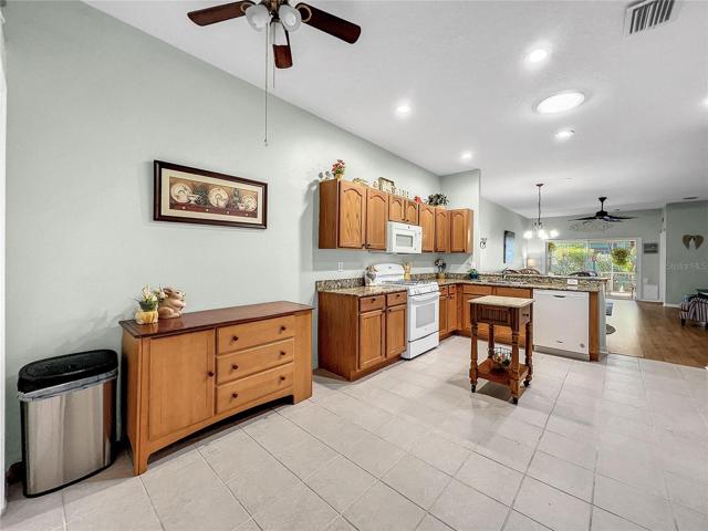 Wall space for more cabinets, kitchen table or large island