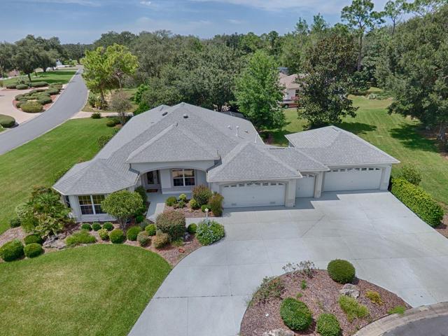 BOND PAID ON THIS EXPANDED 3/2 CUSTOM GARDENIA WITH 4 CAR GARAGE + GOLF CART GARAGE LOCATED IN THE VILLAGE OF HARMESWOOD OF BELLE AIRE!