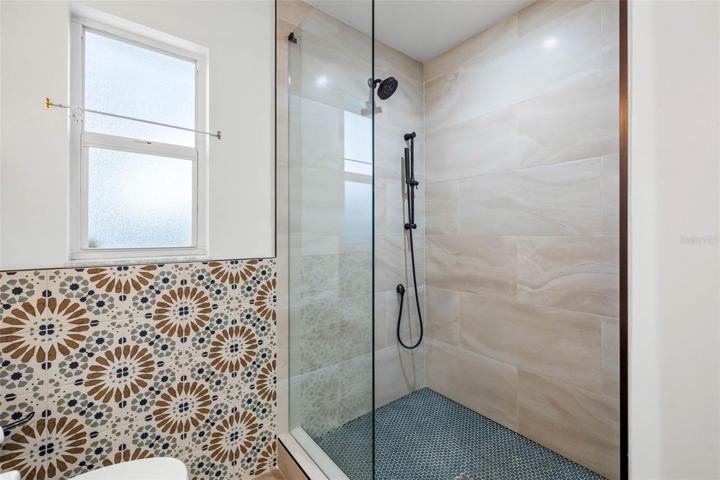 Studio full bath with glass shower enclosure