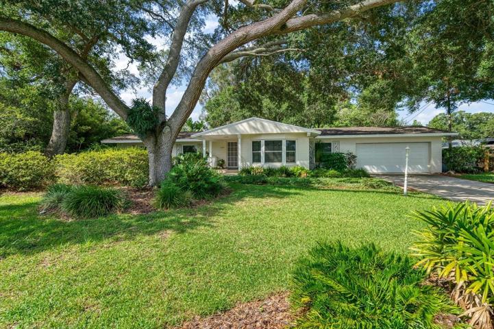 Front elevation of this 4 BR 2 BA central Clearwater home