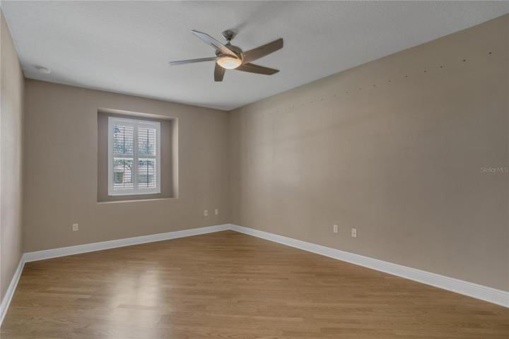 den/ office  extremely large with wood floors.