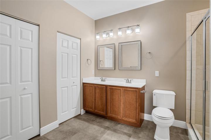 door closest to vanity is massive walk in california closet