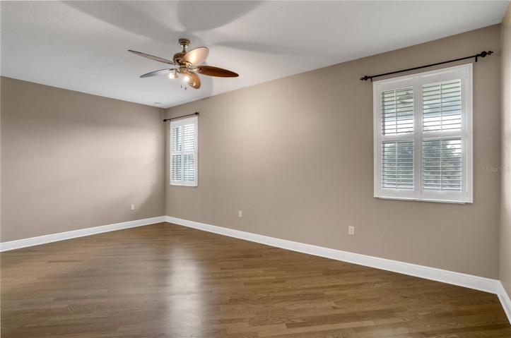master bedroom with wood floors