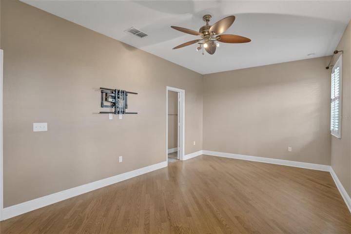 master bedroom with wood floors