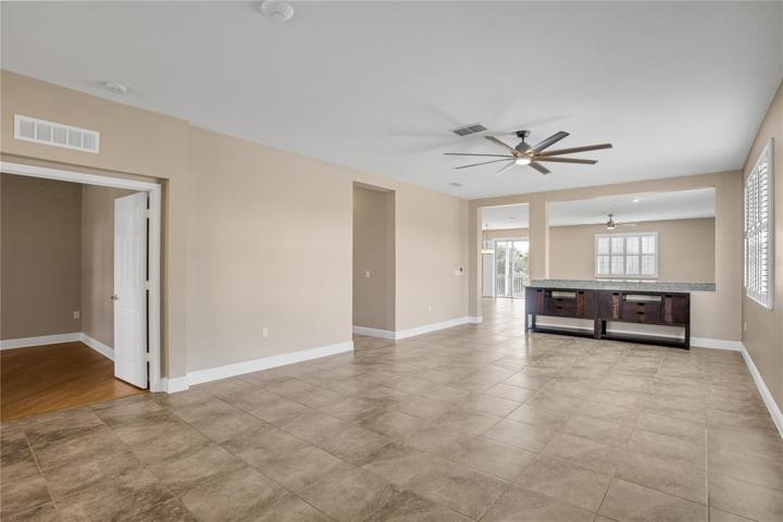 formal living room and to the left is the cdouble doors which lead to the large office/flex space. If needed easily make this into a 4th bedroom. Just need a closet!
