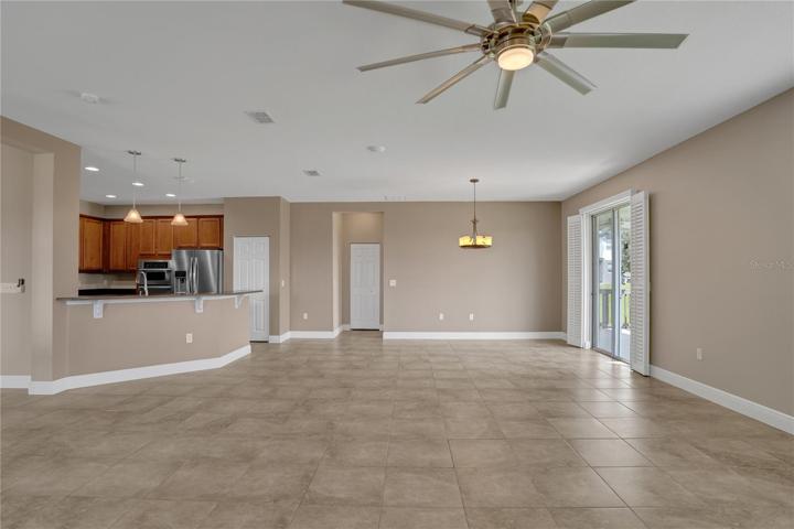 view from the great room overlooking the kitchen, dining nook and door straight ahead eads to master retreat.