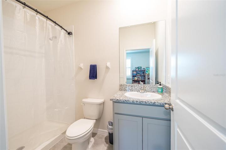 Bath inside of 4th bedroom for muti-generational living.
