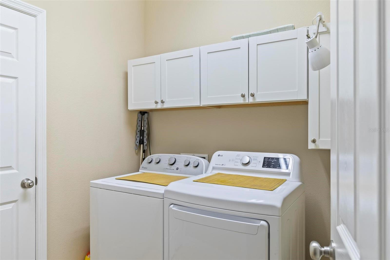 Laundry room with cabinets