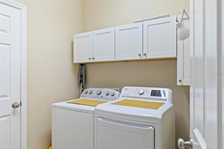 Laundry room with cabinets