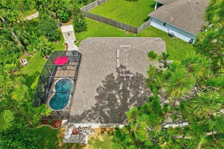 Drone view of home and pool
