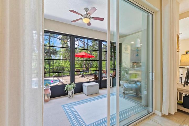 View from inside to lanai and enclosed pool area