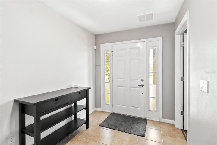Main entry features your FIRST Master Bedroom with a full bathroom and garage access.