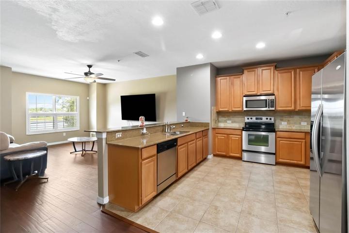 Gorgeous kitchen family room combo has all the bells and whistles!