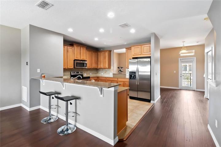 Breakfast bar creates ideal quick breakfast and entertaining while creating an open concept feel to the space.