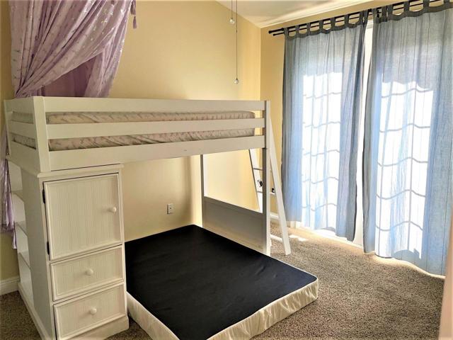 2nd bedroom w/ French doors to balcony at front of the unit.