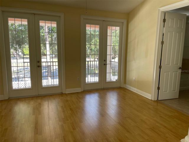 Master suite w/French doors to the private balcony. Open door on the right leads to Master bath.