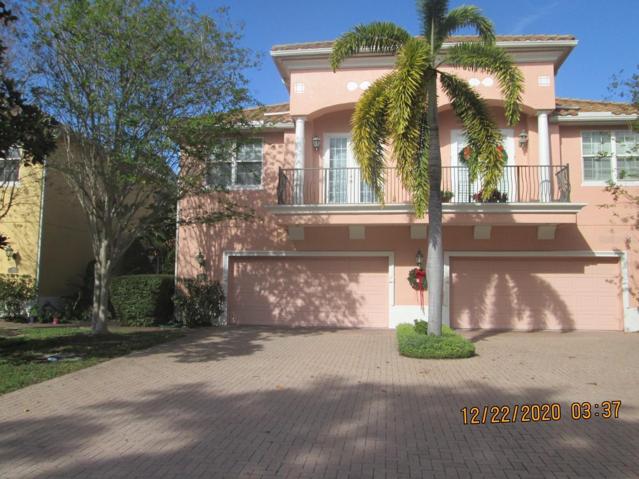 Exterior front (#130 is the left side of the building.) French doors on 2nd level open to Bedroom 2.