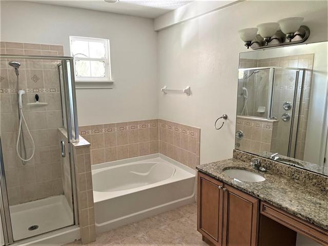 Master bath ensuite with separate shower and tub.