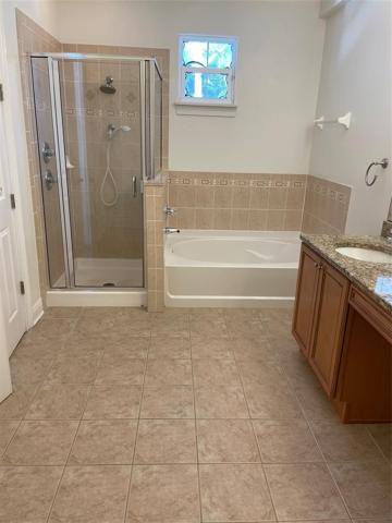 Spacious  master bath w/tile floor, double vanity, separate shower and garden tub.