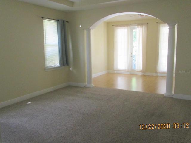 Master suite w/French doors to the rear balcony.